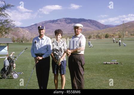 Portrait of three golfers posing on the fairway at Mountain Dell canyon course, just outside of Salt Lake City, Utah, 1967. () Stock Photo