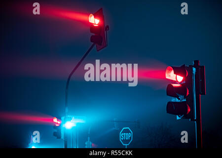 Red traffic light in fog Stock Photo