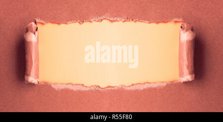 Torn paper in open writing space Stock Photo
