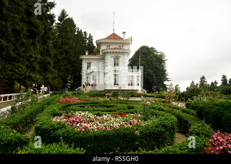 Trabzon, Turkey - September 7, 2018. Exterior view of Ataturk Mansion in Trabzon, with vegetation and people. Stock Photo