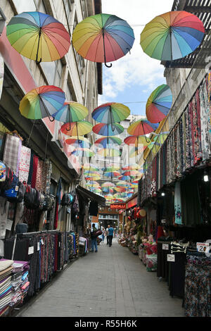 Trabzon, Turkey - September 8, 2018. Street view in the bazaar district of Trabzon, with commercial properties, people and umbrellas. Stock Photo