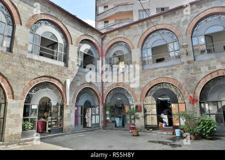 Trabzon, Turkey - September 8, 2018. View of historic Tas Han, commercial building dating from 1530, in Trabzon, with commercial properties and people Stock Photo