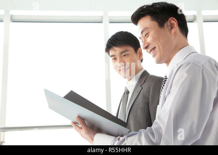 Two businessmen working together Stock Photo