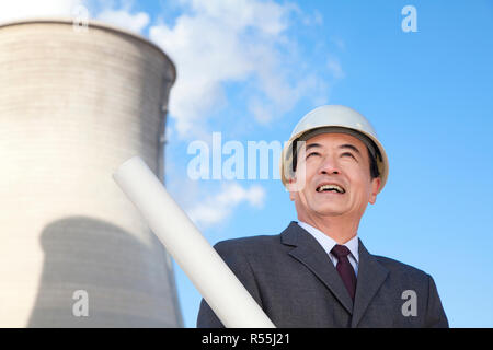 Businessman at power plant Stock Photo