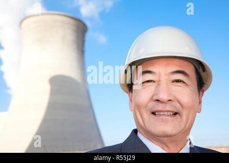 Businessman at power plant Stock Photo