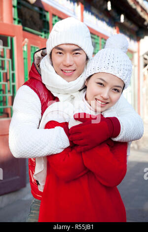 Happy couple hugging in Hutong Yard Stock Photo