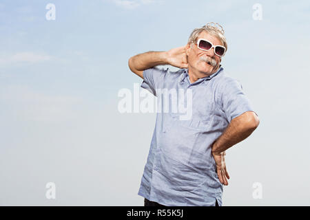 Man wearing a tiara and sunglasses Stock Photo