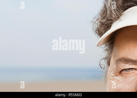 Close up of woman wearing a sun visor Stock Photo