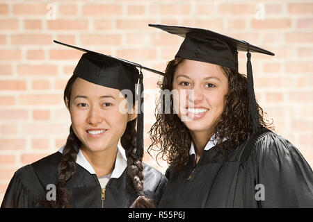 Two female graduates Stock Photo