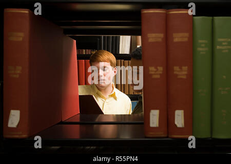 Two students reading in the library Stock Photo