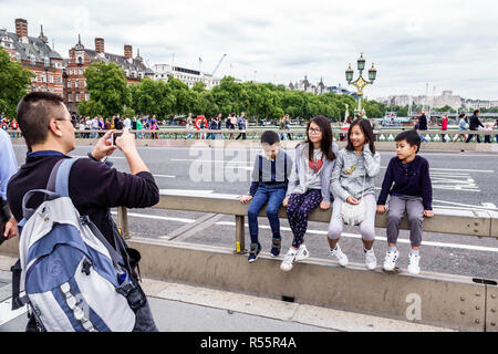 London England,UK,United Kingdom Great Britain,Westminster Bridge,Thames River water,Asian Asians ethnic immigrant immigrants minority,adult adults ma Stock Photo