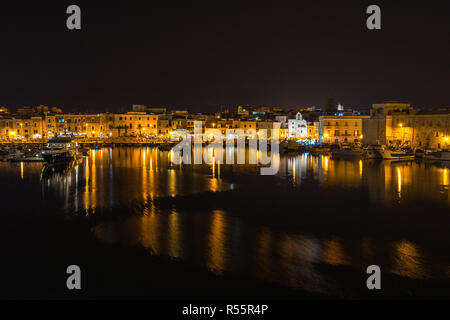 Night view of Trani waterfront and port, Apulia, Italy Stock Photo