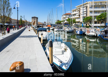 Boats moored at the colorful canal of Cervia. Cervia, Emilia Romagna, Italy, August 2017 Stock Photo