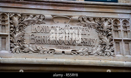 Chichester, United Kingdom - October 06 2018:   A carving above the old London and County Bank, now a NatWest branch on East Street Stock Photo