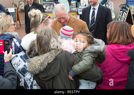 Prince Charles and Camilla,Duchess of Cornwall,visiting  Ely Farmers' Market in Cambridgeshire.   Prince Charles was given a big kiss by a woman in the crowd as he arrived at Ely Farmers' Market in Cambridgeshire today (Wed).  The Prince of Wales received the warm welcome as he met stallholders together with the Duchess of Cornwall.  The couple were introduced to a variety of traders, including producers of Aberdeen Angus beef, flower farmers, local growers of salad vegetables, chillies and soft fruit, as well as bakers and vegan food entrepreneurs. Stock Photo