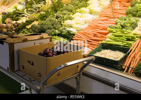 Vegetables on a supermarket shelf Stock Photo