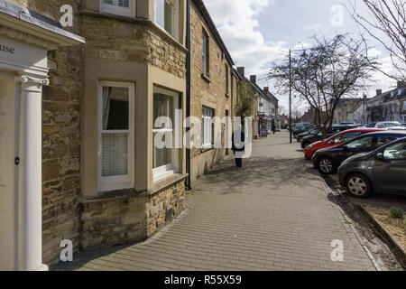 The wide High Street, lined by Georgian houses, in the pretty market town of Olney, Buckinghamshire, UK Stock Photo