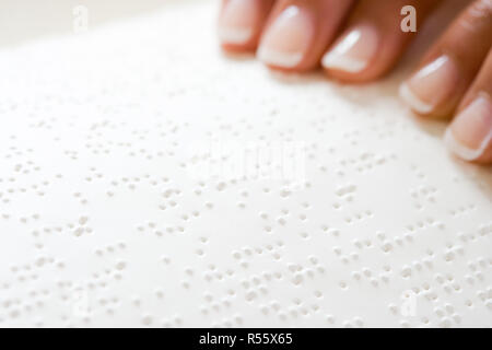 Woman reading braille Stock Photo
