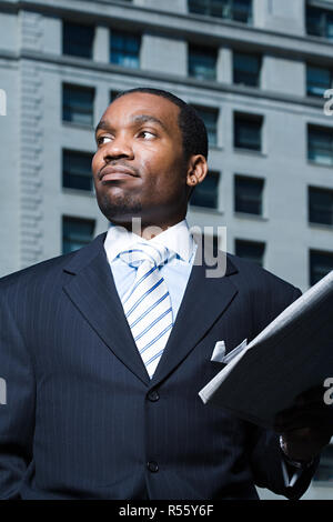 Businessman with newspaper Stock Photo