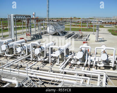 Heat exchangers in a refinery. The equipment for oil refining Stock Photo