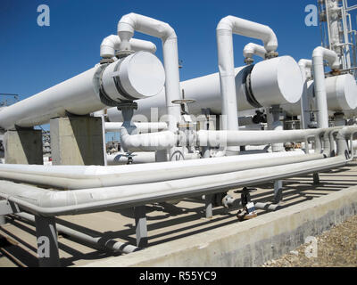 Heat exchangers in a refinery. The equipment for oil refining Stock Photo