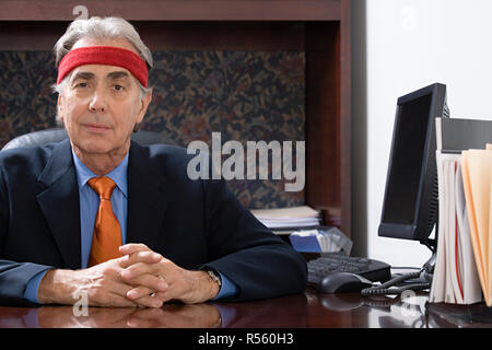 Businessman wearing a sweatband Stock Photo