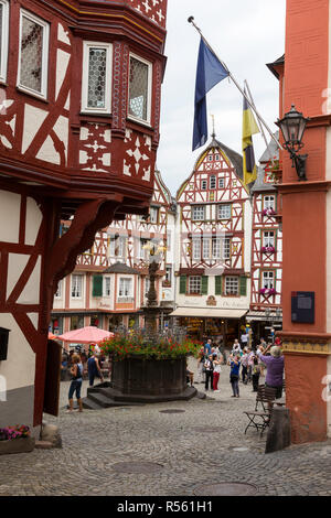 Bernkastel, Germany.  Market Square and St. Michael's Fountain Surrounded by Half-timbered Houses. Stock Photo