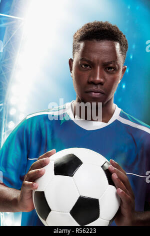 Athlete with soccer ball Stock Photo