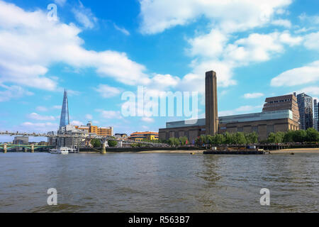 Bankside, Southwark, London, uk - June 8, 2018: view from the river Thames of Tate Modern art gallery, millennium bridge and shard in the skyline. Tak Stock Photo