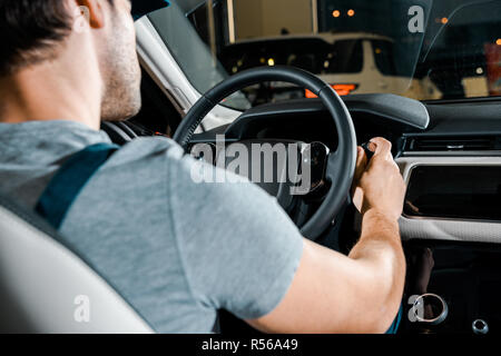 partial view of mechanic checking car cleaning unit work Stock Photo