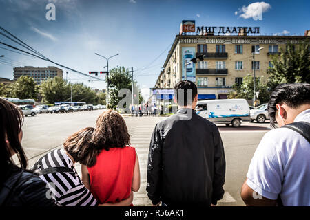 Ulaanbaatar, Mongolia - Sep 9th 2018 - Local people waiting to cross a wide avenue in Ulaanbaatar, capital of Mongolia Stock Photo