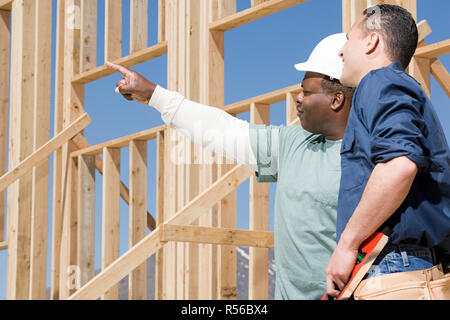 Builders on a construction site Stock Photo