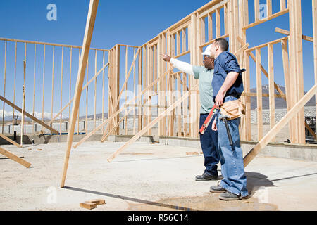 Builders on construction site Stock Photo