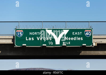 Las Vegas Interstate 15 and 40 freeway arrow sign in the Mojave desert near Barstow, California. Stock Photo