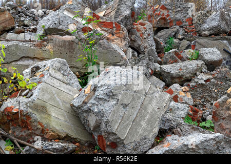 A pile of gray concrete debris from the pile and stones of the destroyed building. Impact of destruction Background. Stock Photo