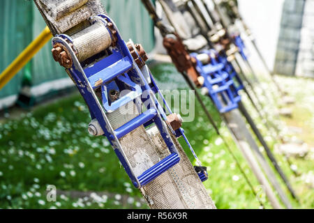 Image of a carabiner hook with a climbing rope Stock Photo