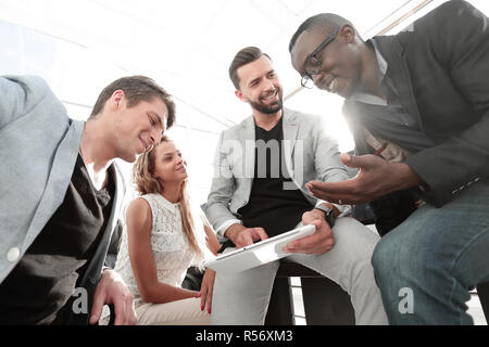 business team uses a digital tablet to check new data Stock Photo
