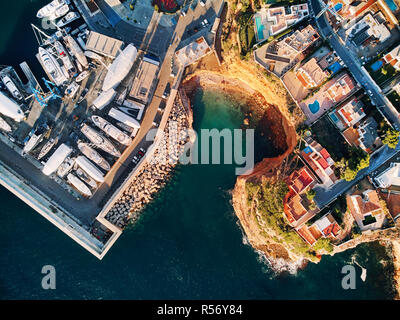 Aerial view directly from above, moored vessels at Port Adriano, located just below the cliffs of the small neighborhood of El Toro villas. Majorca Stock Photo