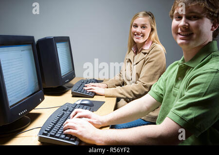 Two students working on computers Stock Photo