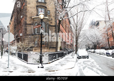 Snowy winter scene at the historic intersection of 10th and Stuyvesant Street in the East Village of Manhattan, New York City NYC Stock Photo