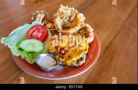 Cheeseburger with handmade onion rings Stock Photo