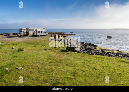 Three caravans by the sea, Garrafad, Isle of Skye, Inner Hebrides, Scotland, UK Stock Photo