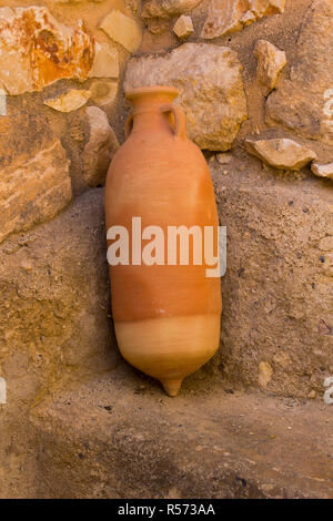 A reproduction fired clay water pot in living history museum of Nazareth Village in Israel. Similar to the type of water pot that would have been used Stock Photo