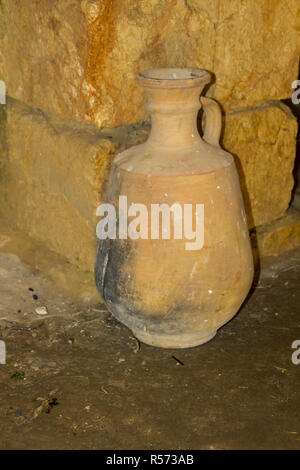 A reproduction fired clay water pot in living history museum of Nazareth Village in Israel. Similar to the type of water pot that would have been used Stock Photo