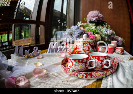 Traditional Chinese tea ceremony cups and tray in wedding day with the symbol known as "Double Happiness" - Chinese Tea ceremony is performed during a Stock Photo