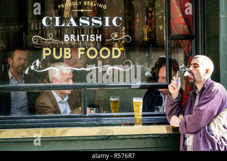 London England,UK,United Kingdom Great Britain,Westminster,Adam & Eve 18th century pub,traditional public house houses,bar bars lounge pub,exterior,Gr Stock Photo