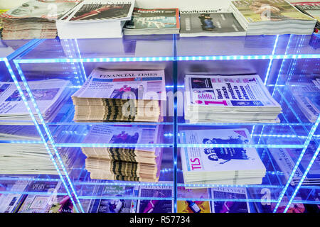 London England,UK,Longford,Heathrow Airport LHR terminal,British Airways Arrivals Lounge,magazine racks,free newspapers,first class business passenger Stock Photo