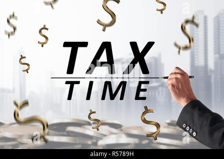 Business person hand with pen writing Tax Time with line Stock Photo