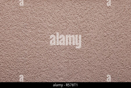 light pink background or texture - plastered wall with ornament Stock Photo