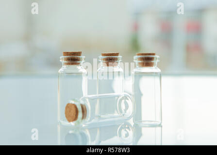 Empty little bottles with cork stopper, close-up Stock Photo